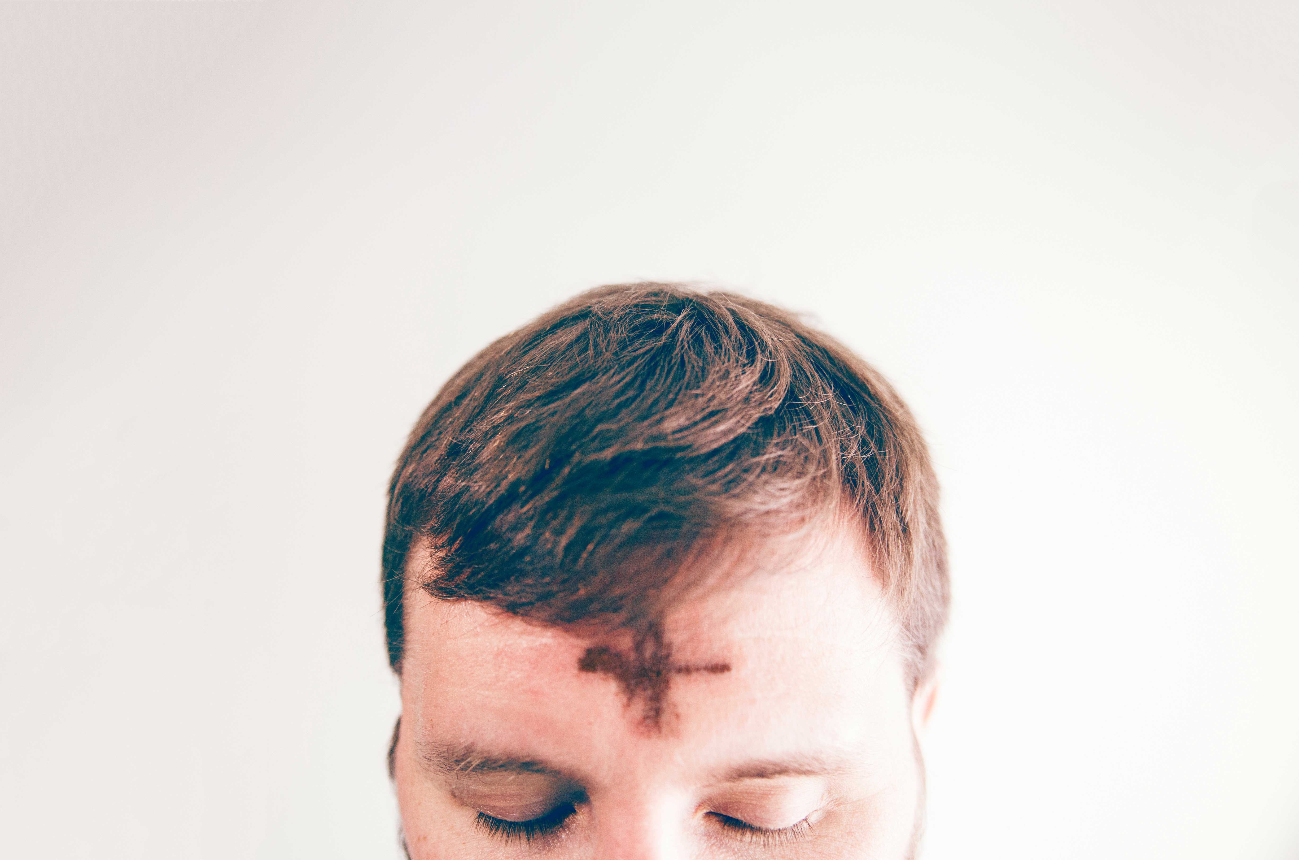 imposition of ashes ash wednesday forehead chld